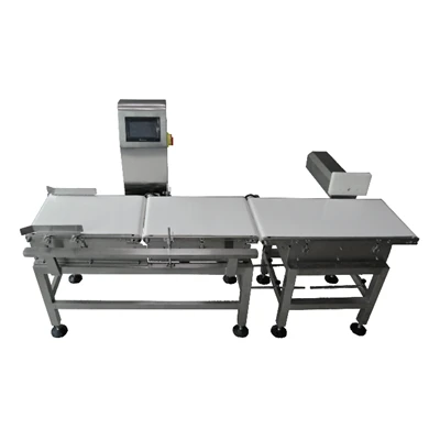 重量検査機と取り外し機